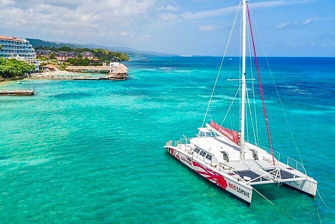 Party Catamaran Cruise with Open Bar and Snorkeling Montego Bay - Key Points