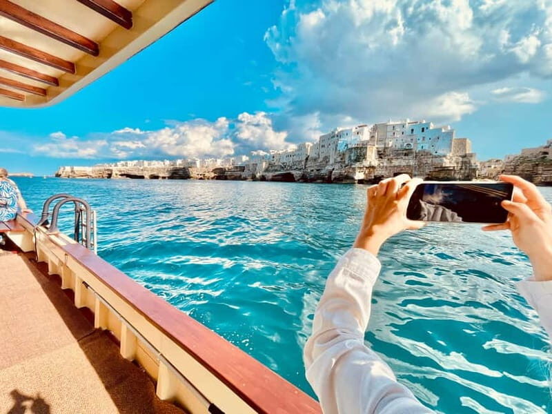 Polignano Monopoli: boat tour on a traditional wooden boat at sunset - Key Points