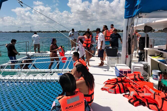 Private Sailing Catamaran to Isla Mujeres from Playa del Carmen - Return journey and sunset views