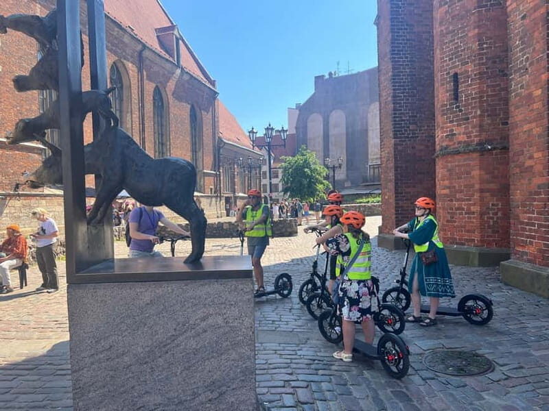 Riga Highlight Big wheel e-scooter Group or Private tour - The Sum Up