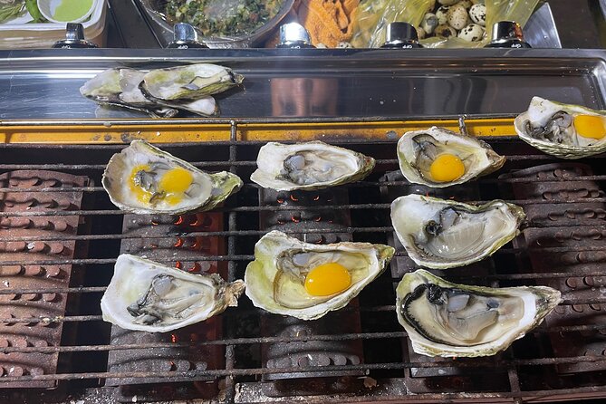 Saigon By Night and Street Food By Motorbike |Opt: Ao Dai Riders - Customization Options Available