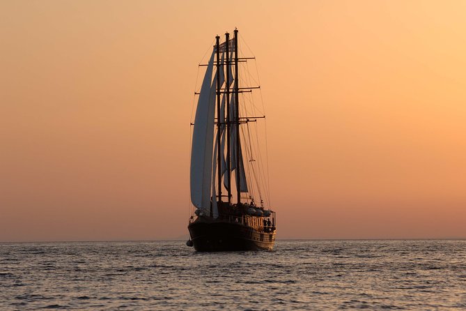 Santorini Caldera Sunset Sailing Cruise With Dinner and Wine - Meeting and Pickup