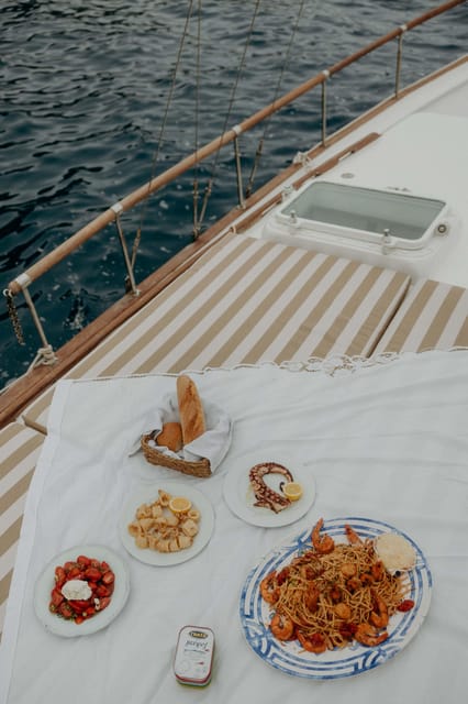 Santorini: Ios Island Overnight Sailing Trip with Meals - Key Points