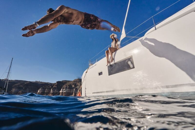 Santorini: Southern Island Luxury Catamaran Cruise with Meal - From Hotel to Marina: Smooth Pickup