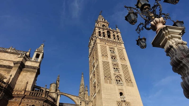 Seville: Cathedral and Giralda Small Group Tour with Tickets - Climbing the Giralda: Panoramic Views and Cultural Insights