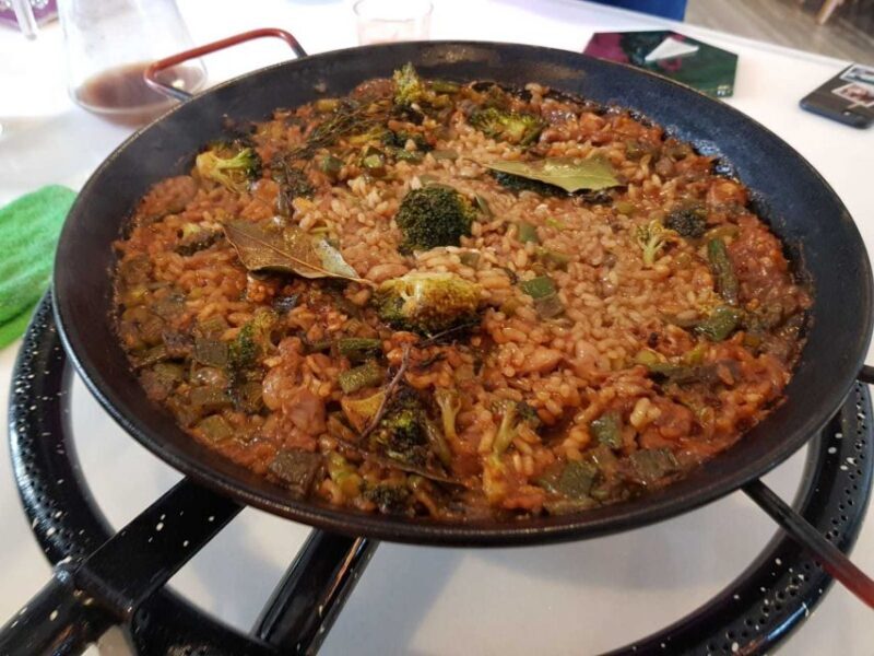 Seville: Paella Showcooking Experience - The Guide and Atmosphere