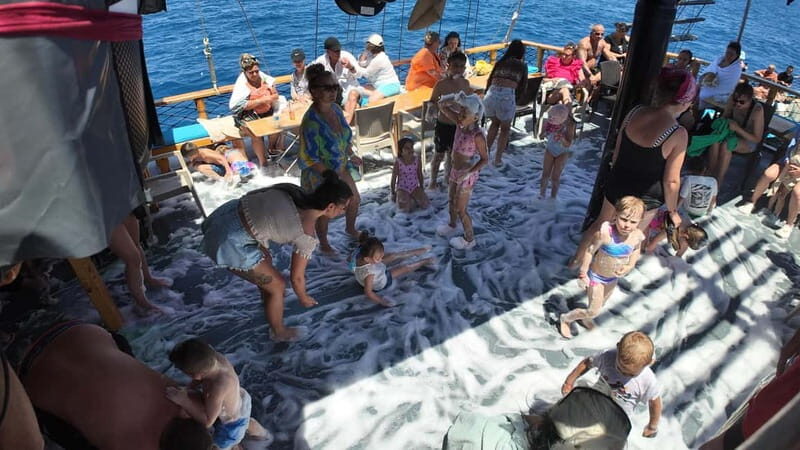 Side: Dolphin Boat Tour With Lunch Foam party Swimming - What Really Sets This Tour Apart