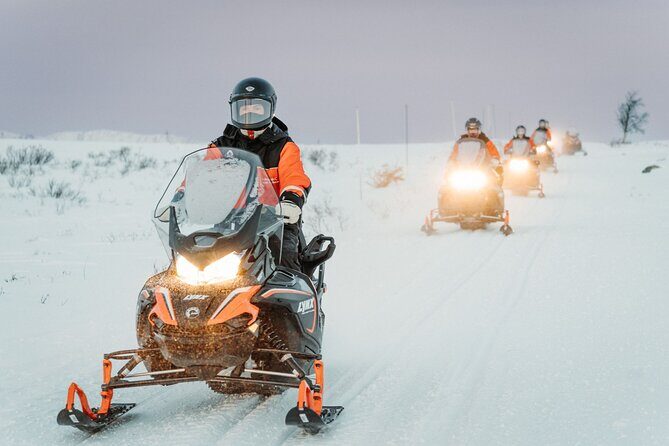 Snowmobile and Icefishing Adventure - Exploring the Arctic Wilderness on Snowmobiles