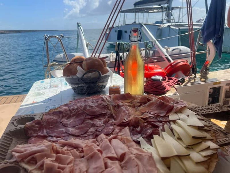 Stintino: full day tour catamaran Asinara Island - Authenticity and Experience