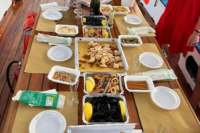 Sunset aperitif on a boat in Scilla - Key Points