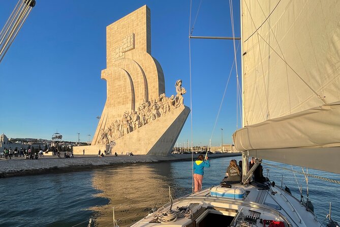 Sunset Boat Tour in Lisbon With Wine - Sailing the Boat