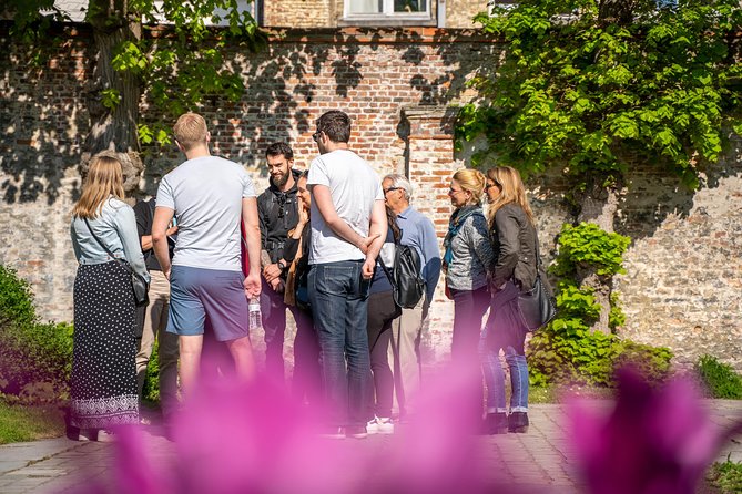 Unveil Bruges Hidden Gems: Guided Walking Tour With Local Treats - Concluding at Meeting Point
