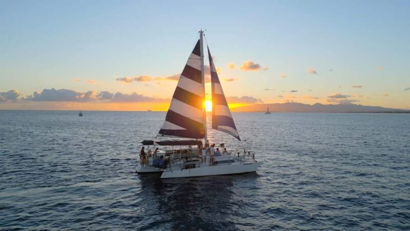 Waikiki: Sunset Swim & Sailing Experience - Key Points